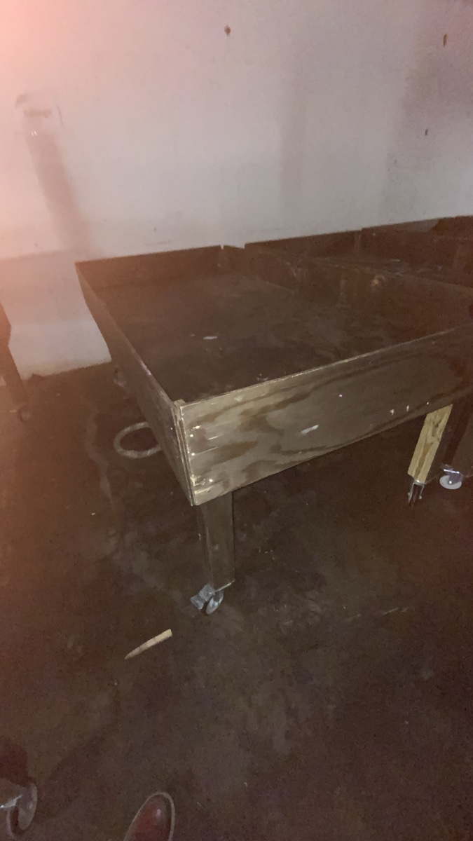 Industrial Wooden Display Table with Caster Wheels